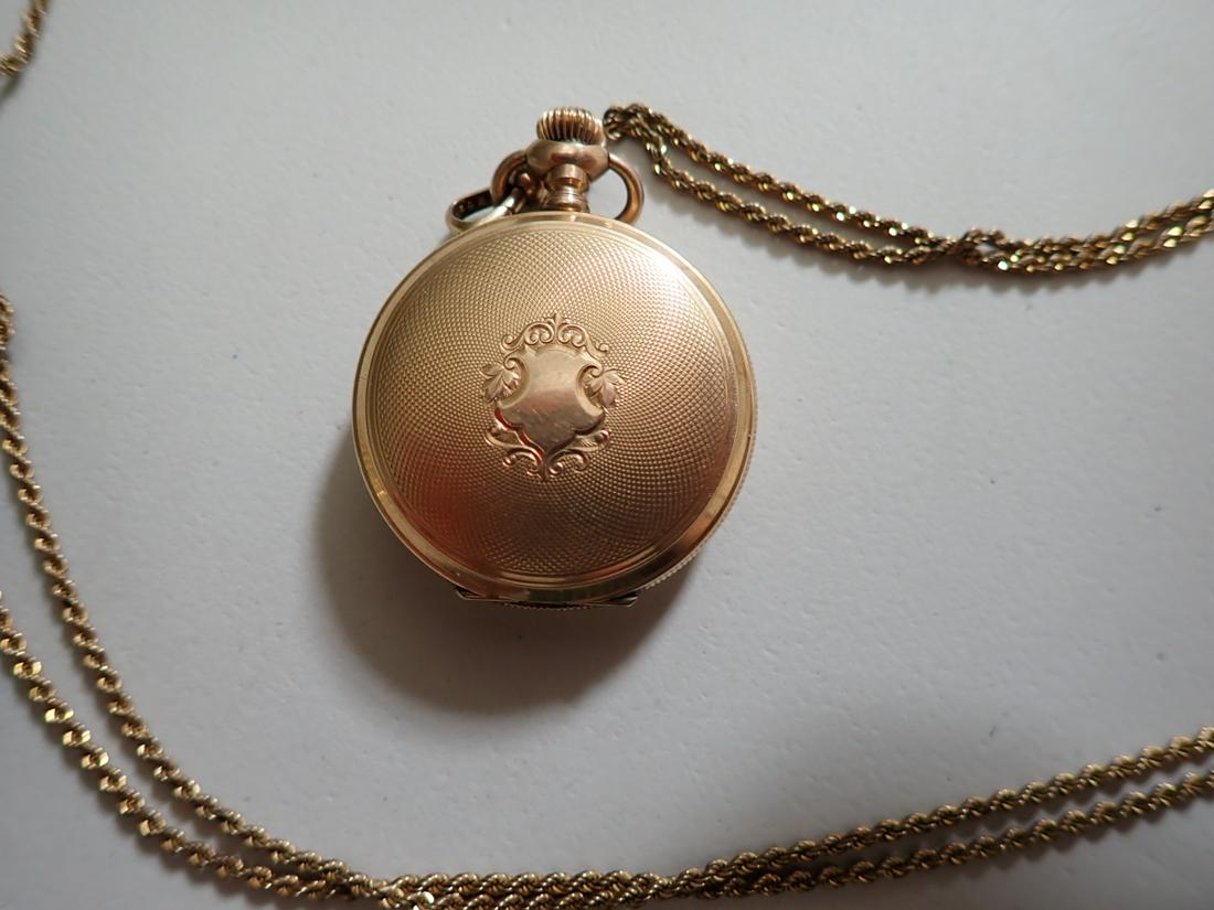 American Waltham Ladies Gold Plated Pocket Watch & Chain: 48" Chain with Heart Shaped Slide S/N 8788500 . Runs for over a minute when wound. Please see photos for details and condition.