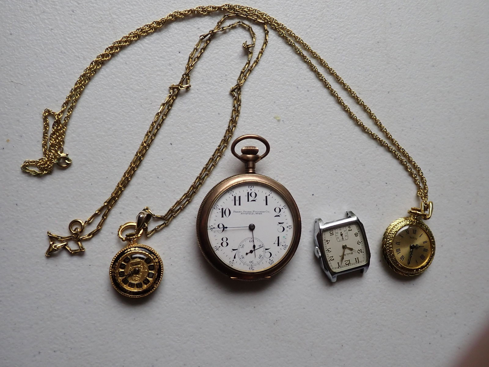 3 Gold Filled Pocket Watches and Watch: Perry, Stone, Pulcher Co. Pittsfield, MA 11 Jewel Gold Filled Pocket Watch, Bulova 10K Rolled FD Gold Plate Men's Watch (no strap) and Kelbert & Sheffield Womans Pocket Watch & Chains. Please see phot