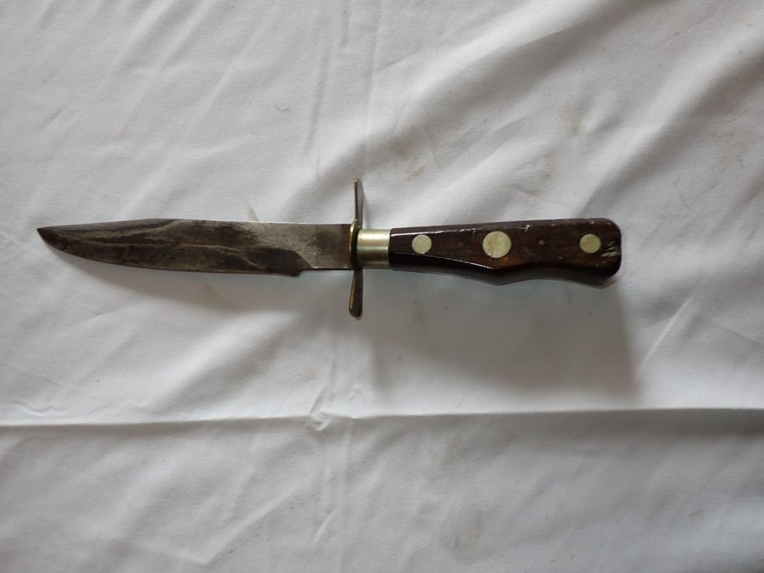 Knife attributed as Buck Knife 11" with Wooden Handle - Worcester, MA: Unmarked. Consignor purchased it as an early Buck knife. It matches other identified examples. Please see photos and come to the 2 day preview for condition.