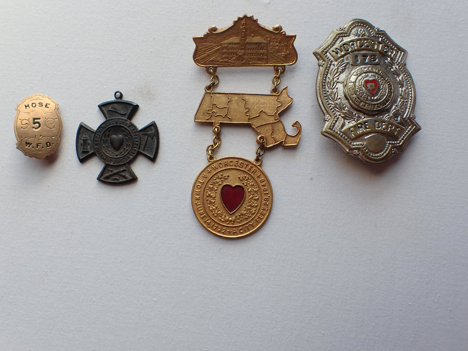Worcester Badge #176 Antique Hose 5 WFD Badge,: Worcester Fire Dept. Cross, 1923 Worcester Medal. Please see photos and come to the 2 day preview for condition.