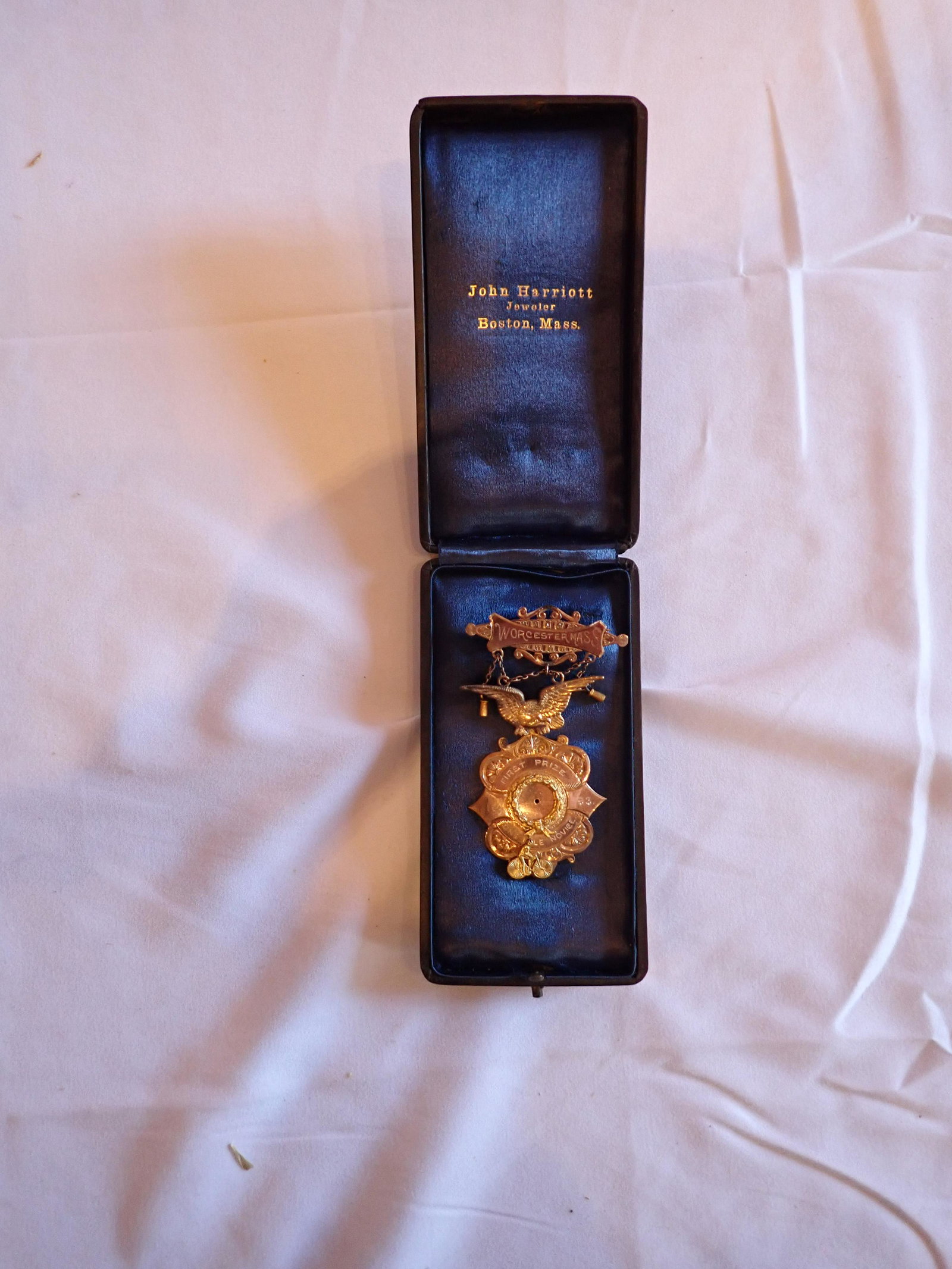 First Place Novel Medal 1 Mile Race 1893: Has detached Metal Bicycle Emblem. Please see photos and come to the 2 day preview for condition.