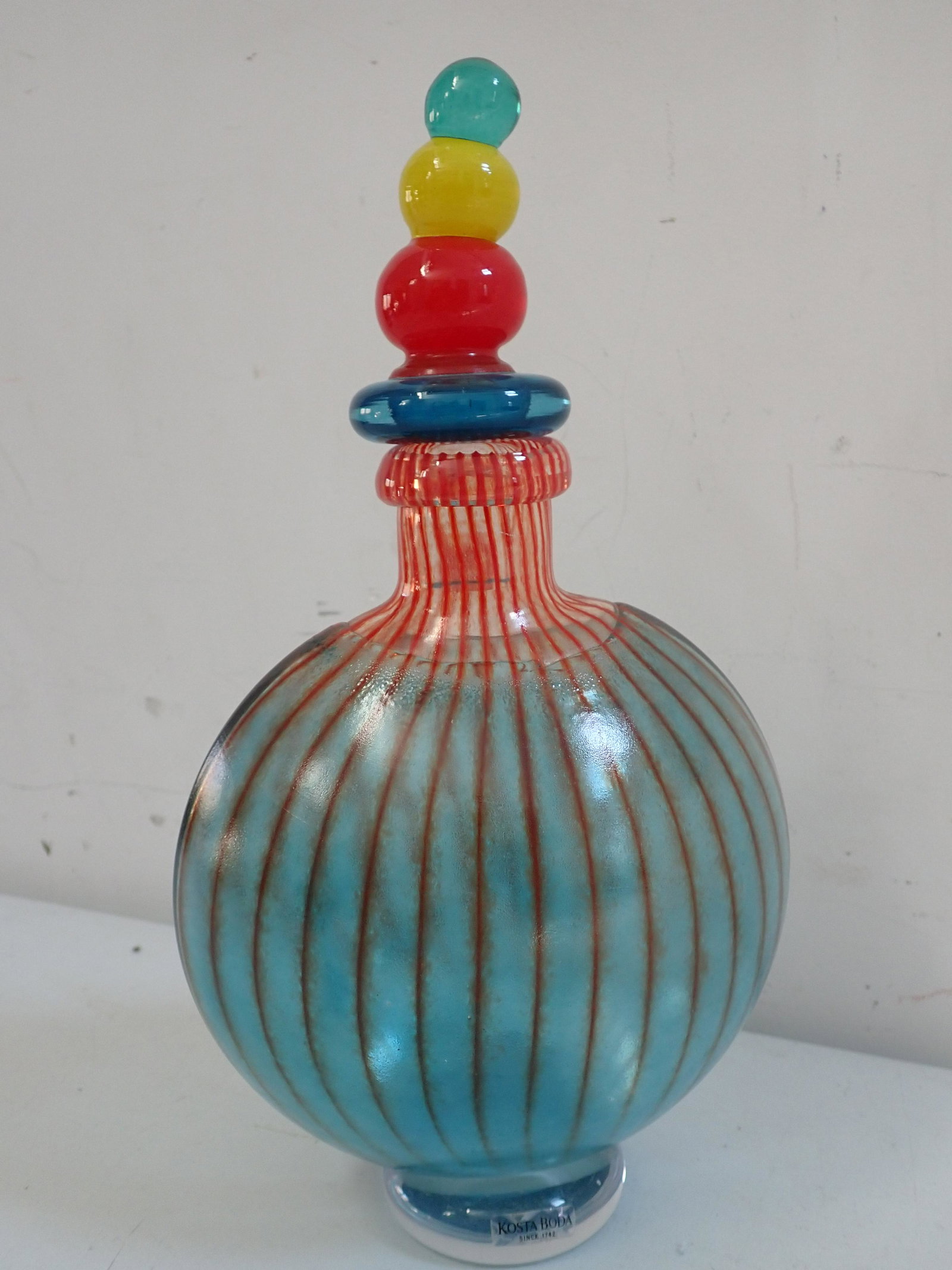 Kosta Boda Glass Bon Bon Decanter by Kjell Engman Signed: "Kosta Boda" Since 1742. 11" with stopper and 8" without. See photos for condition and details. Local pick-up available on February 4th or 3rd party shipping available. Please see terms.