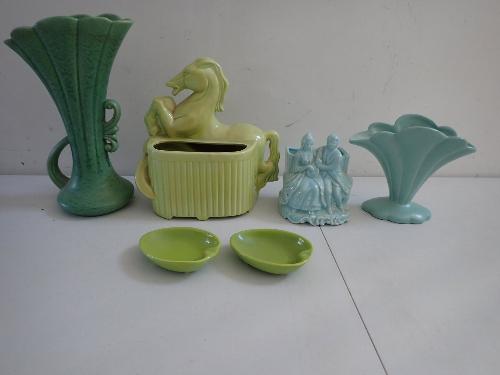 Mid Century Modern Horse Planter - Avocado Green & Other: Pottery. Horse planter is 9 1/2" high x 9 1/2" wide, Man and woman planter with W a heart in middle and K on back is 6" high x 5" wide, The Made in USA green vase is 12" high, (2) 4 1/2" wide green di