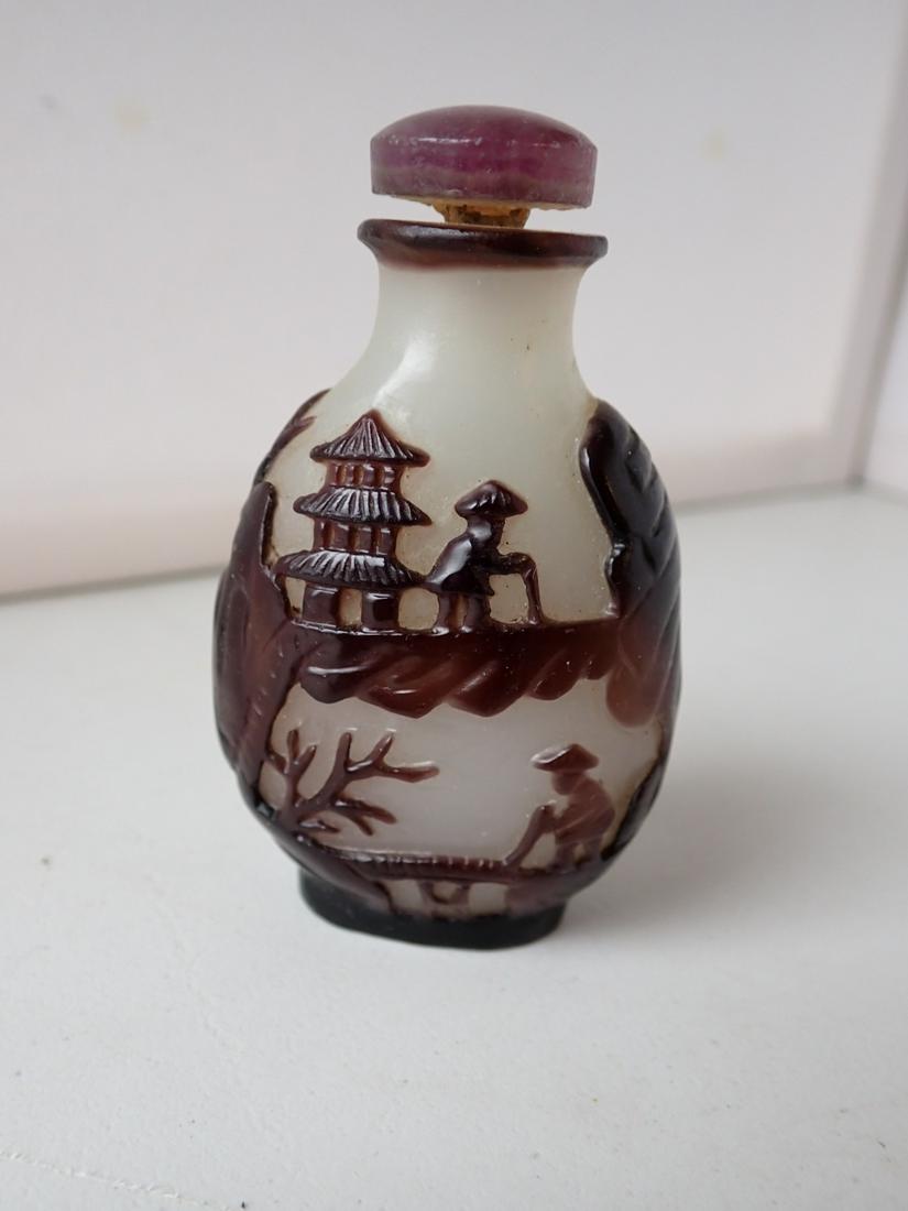 Chinese/Asian Snuff Bottle Opaque Colored Glass Maroon: Overlay Picturing Man with Cane Walking and a Man Fishing on Other Side. 2 3/4" high. See photos for condition and details. Local pick-up available on February 4th or 3rd party shipping available. Ple