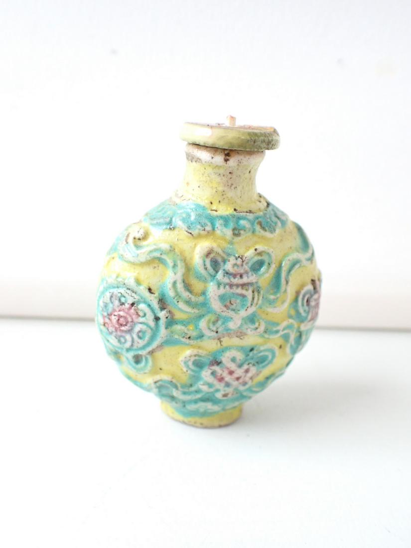Chinese Yellow, Blue and Pink Clay Pottery Snuff Bottle: 2 1/4" including top. See photos for condition and details. Local pick-up available on February 4th or 3rd party shipping available. Please see terms.