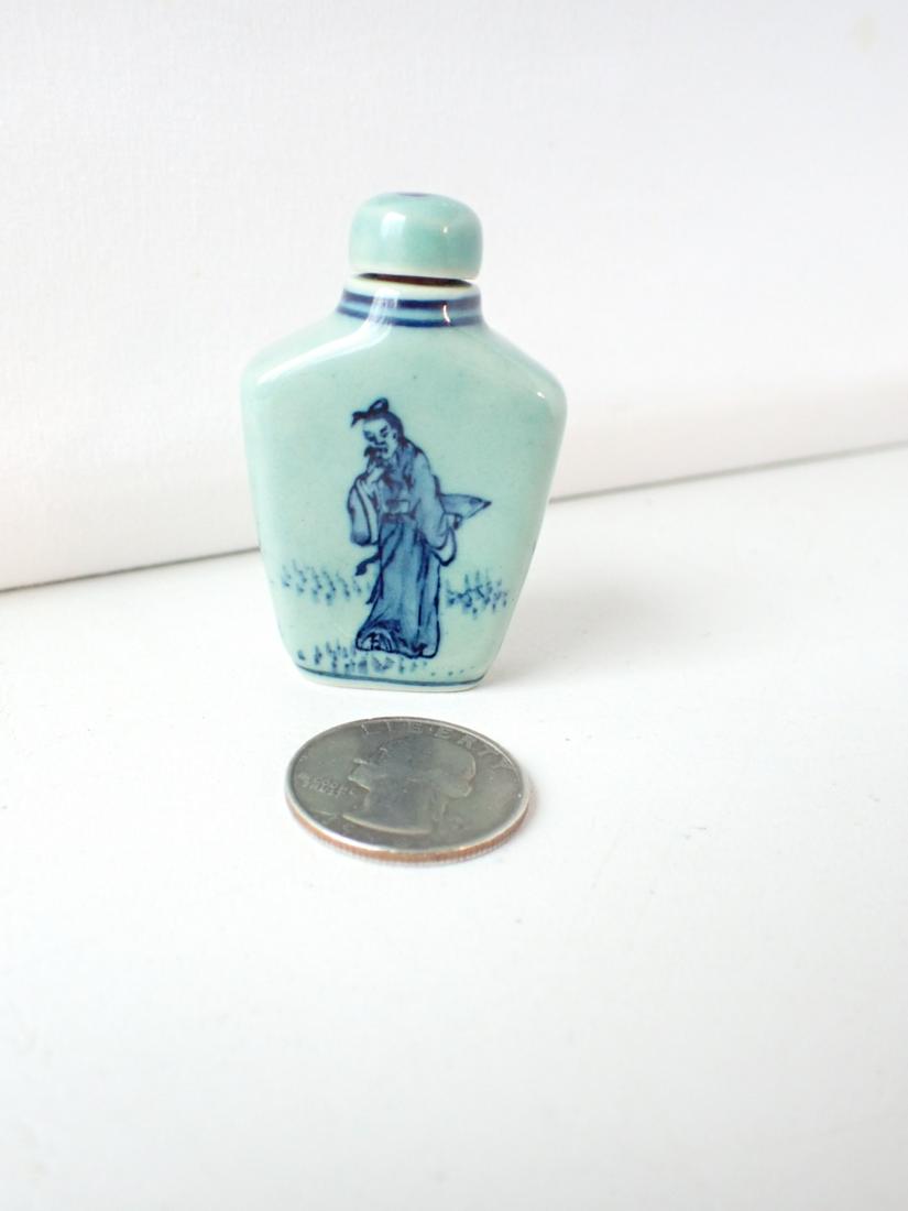 Chinese Snuff Bottle Aqua Bottle with Cobalt Designs of Woman: with Fan and Man with Duck on Reverse 2". See photos for condition and details. Local pick-up available on February 4th or 3rd party shipping available. Please see terms.