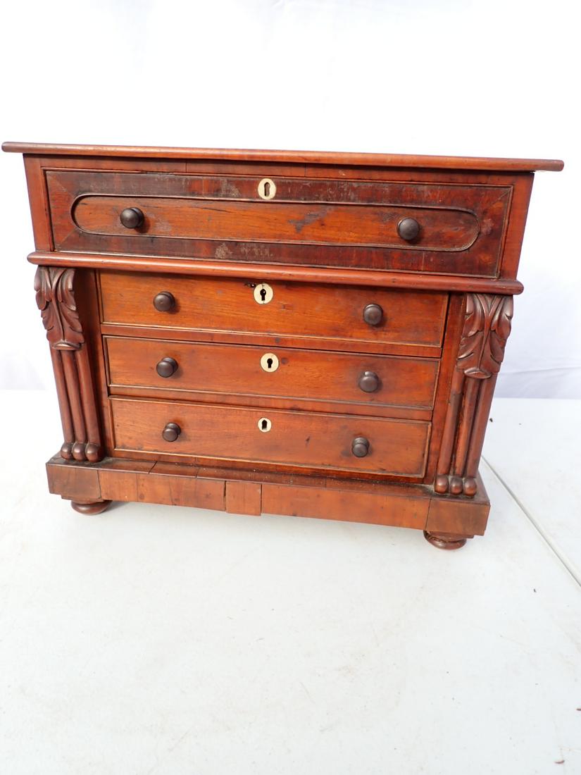 Antique Miniature 4 Drawer Carved Chest with Bone Keyholes: The veneer has some splits and one piece has been reattached. 14" High x 16 1/2" wide x 9" deep. See photos for condition and details. Local pick-up available on February 4th or 3rd party shipping ava