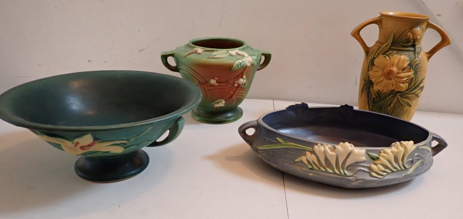 Roseville Vases, 2 Handles Dish and Bowl: Appr. 6" Vase, 9" Vase, 14" 2 Handled Dish (slight rough spot on rim) and 11" Diamter Dish - 4 1/2" Diameter Bottom. See photos for condition and details. Local pick-up available on February 4th or 3r