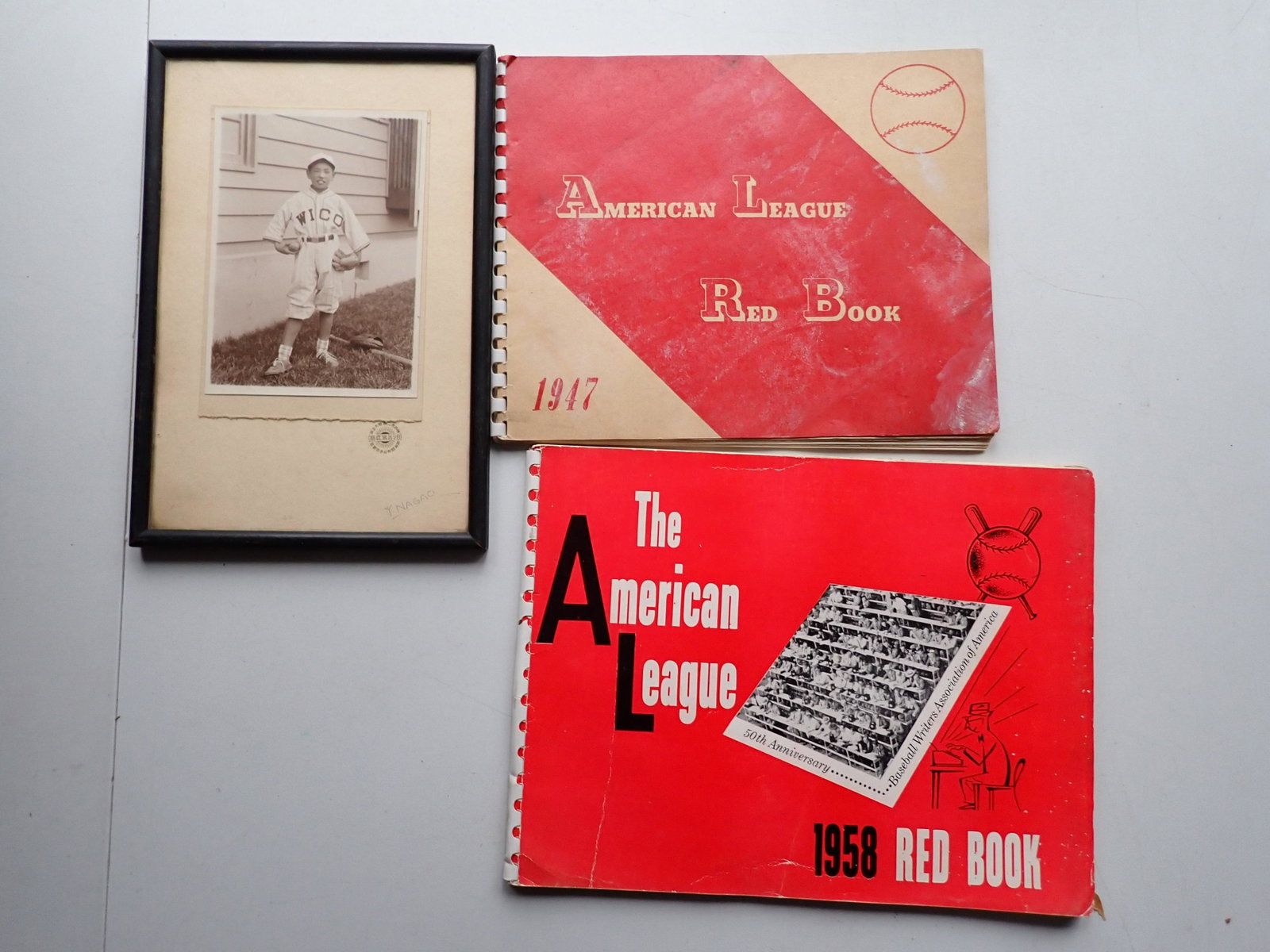 1947 & 1948 American League Red Books & 1930 Baseball Photo: 1930 Photo of Japanese Boy in Baseball Uniform. 1947 Red Book has some discoloration on cover. Photo Frame size: 10" x 7". See photos for condition and details. Local pick-up available on February 4th