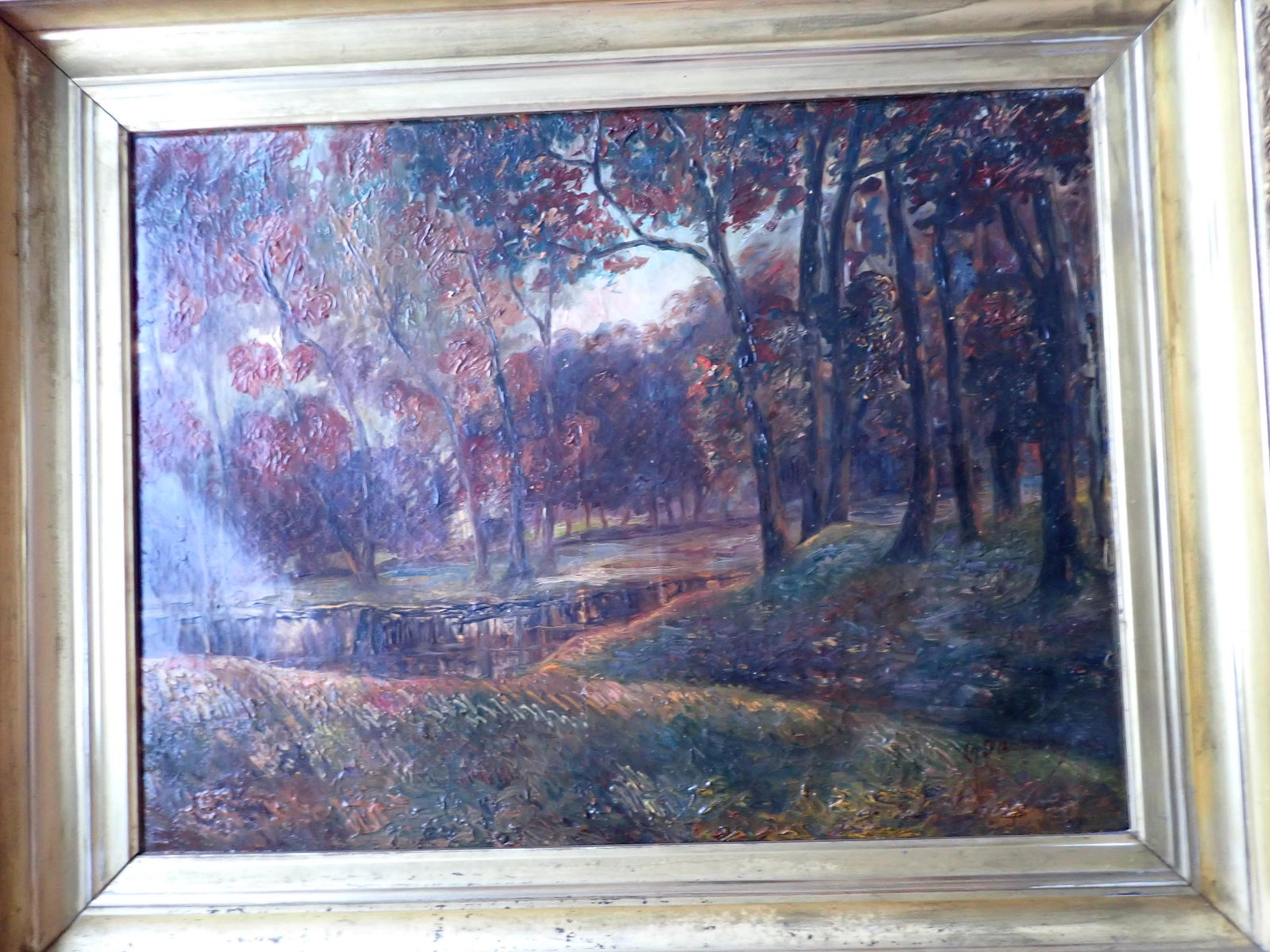 Signed and Dated March 1922 Oil on Canvas: A Madame et M Roy en Souvenir de Leur Sejoun a Jarney. 28 1/2" x 36". Frame. Art: 21" x 27". Front is signed 1921. Gold Gild Frame has some chips. Canvas has some cracking and wear spots. Has some res