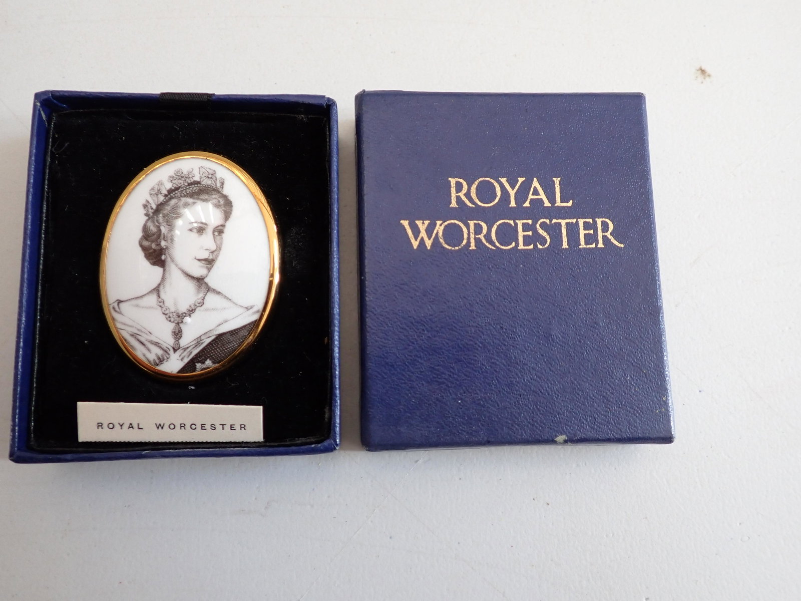 Queen Elizabeth Royal Worcester Coronation China Pin/Brooch: Royal Worcester Coronation June 2, 1953 Bone China Pin with Box. Unused Pin/Brooch. Comes with Original Box with Pull Out Tray/Easel For Display. Brooch commemorating the Coronation of Queen Elizabeth