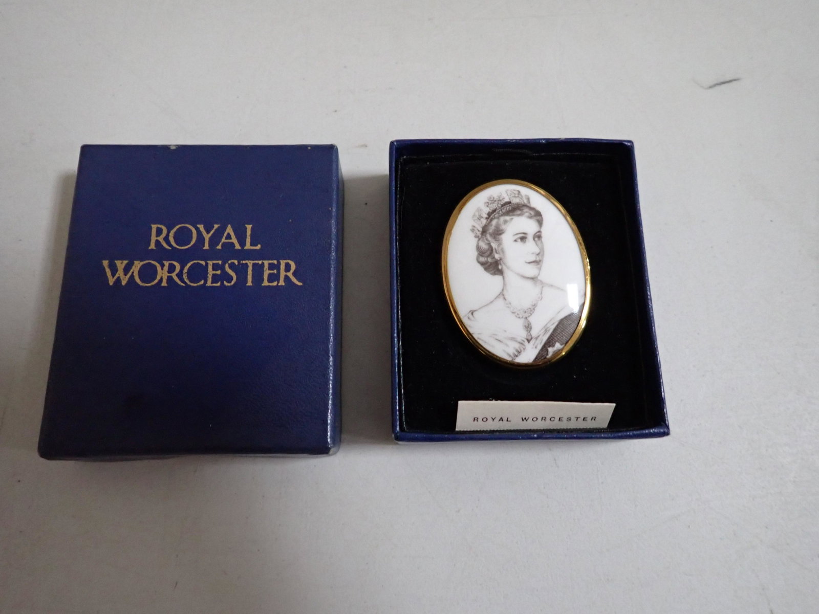Queen Elizabeth Royal Worcester Coronation China Pin/Brooch: Royal Worcester Coronation June 2, 1953 Bone China Pin with Box. Unused Pin/Brooch. Comes with Original Box with Pull Out Tray/Easel For Display. Brooch commemorating the Coronation of Queen Elizabeth