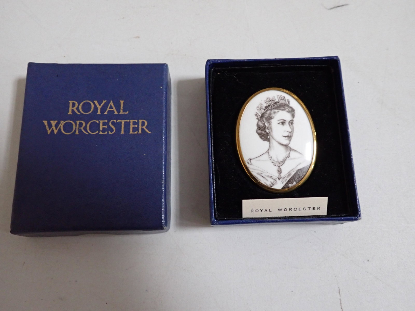 Queen Elizabeth Royal Worcester Coronation China Pin/Brooch: Royal Worcester Coronation June 2, 1953 Bone China Pin with Box. Unused Pin/Brooch. Comes with Original Box with Pull Out Tray/Easel For Display. Brooch commemorating the Coronation of Queen Elizabeth