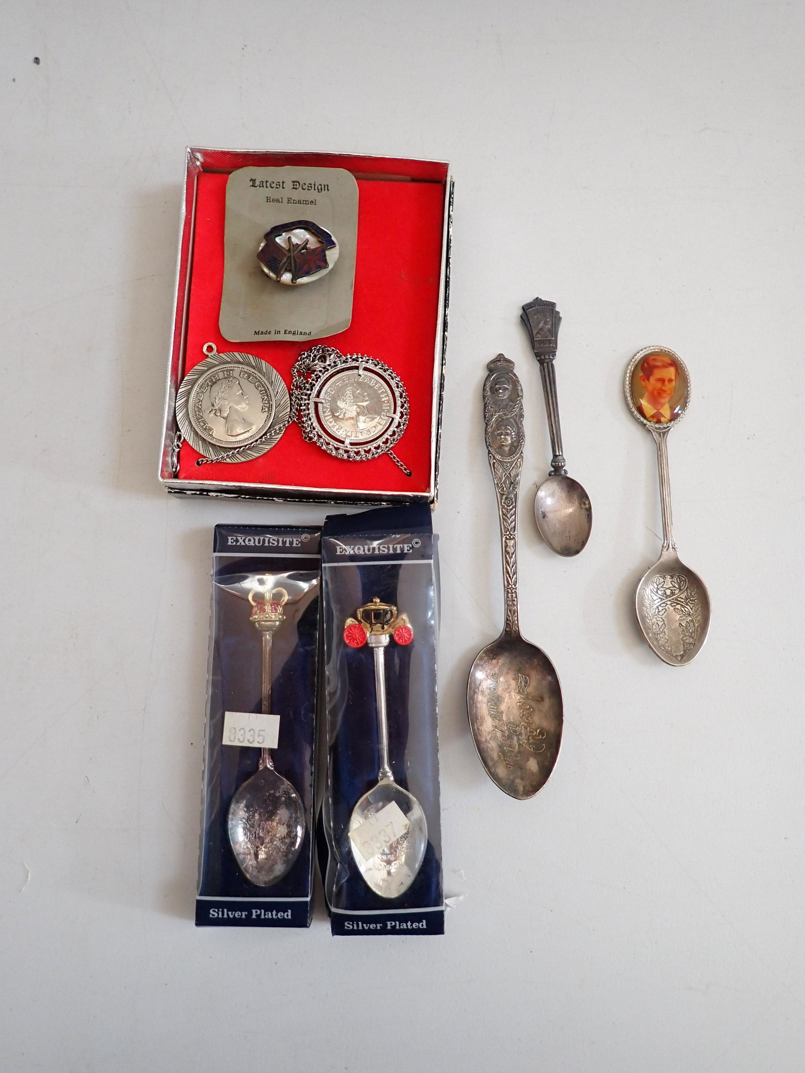 Queen Elizabeth Coins, Prince Charles & Other Spoons, etc: Coins are 1967 Queen Elizabeth 1/2 Penny and Queen Elizabeth Coin Mounted on Pendant, Coronation Spoon, There"ll Always Be England" Spoon, Prince Charles (Now King Charles) Souvenir Spoon, Exquisite S