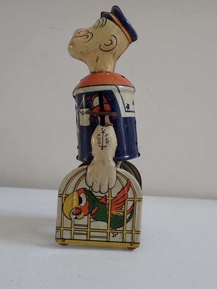 Wind Up Popeye Tin Toy. Marx. Working Condition: 9 1/2" tall. Slight wear, overall good condition.