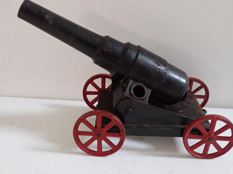 Cast Iron Cannon and Cart. Cart is Pressed Steel.: 11 1/2" long. Cascable missing.