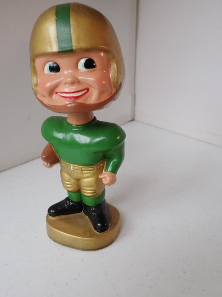 1960's Green Bay Packers Bobble Head Nodder.: Uniform is Unlabeled. Nodder has Green Bay Uniform Colors. Overall Good Condition. Appr. 7"