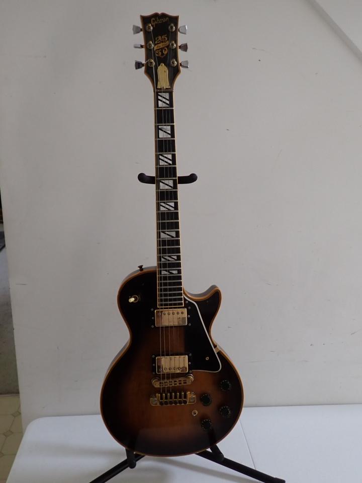 Gibson Les Paul 25/50 Anniversary Guitar Mother of Pearl No. 73338083 21: on headstock and frets. 39 1/2". Has some wear on pickups and small scuffs.