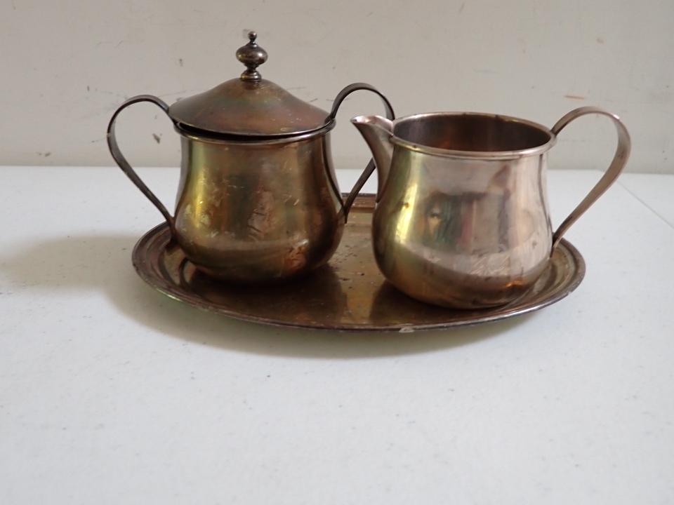 Sterling International Silver Creamer, Sugar & Underplate: Has some denting of creamer and sugar. Sugar lid fits loosely. 11.2 troy ounces
