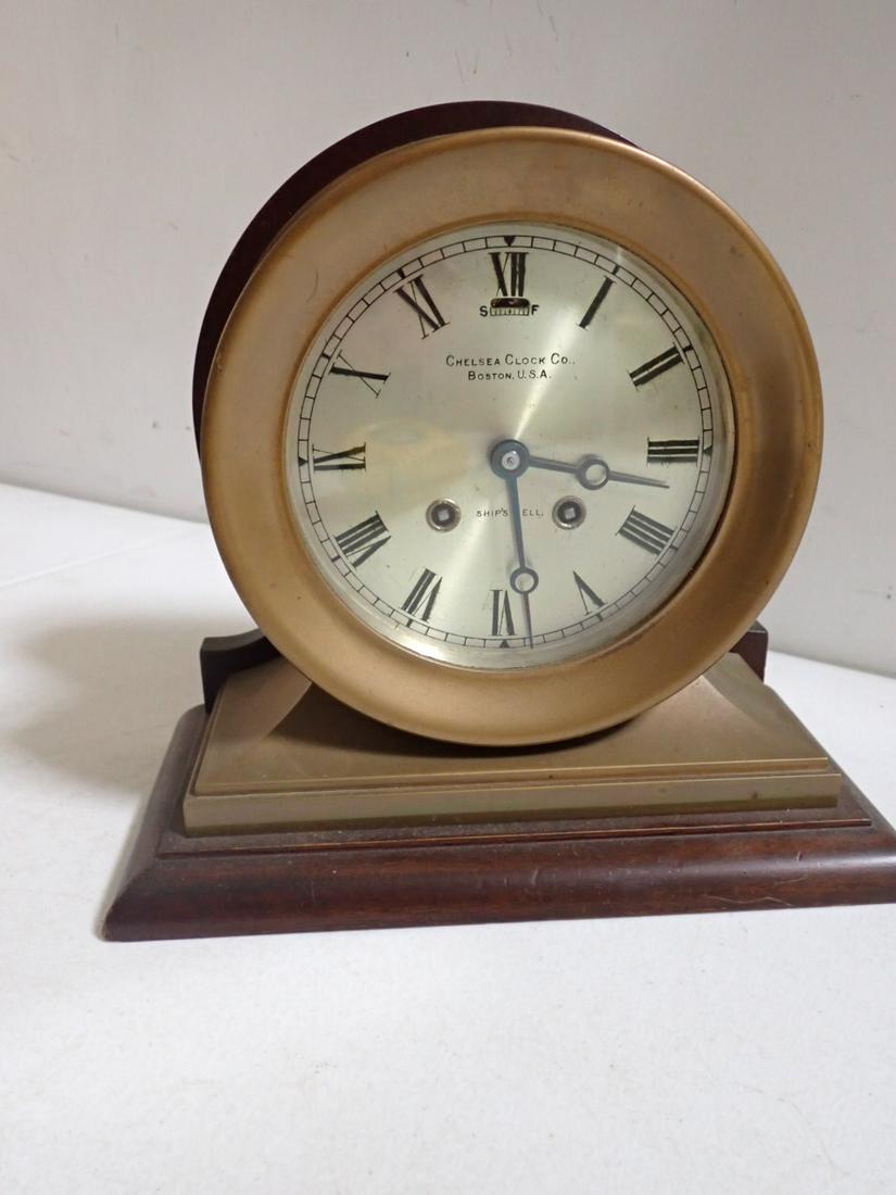 Chelsea Ship's Bell Brass Clock Chelsea Clock Co. Boston, MA: Mounted on wood - 9 1/2" High - 7 1/4" Diameter