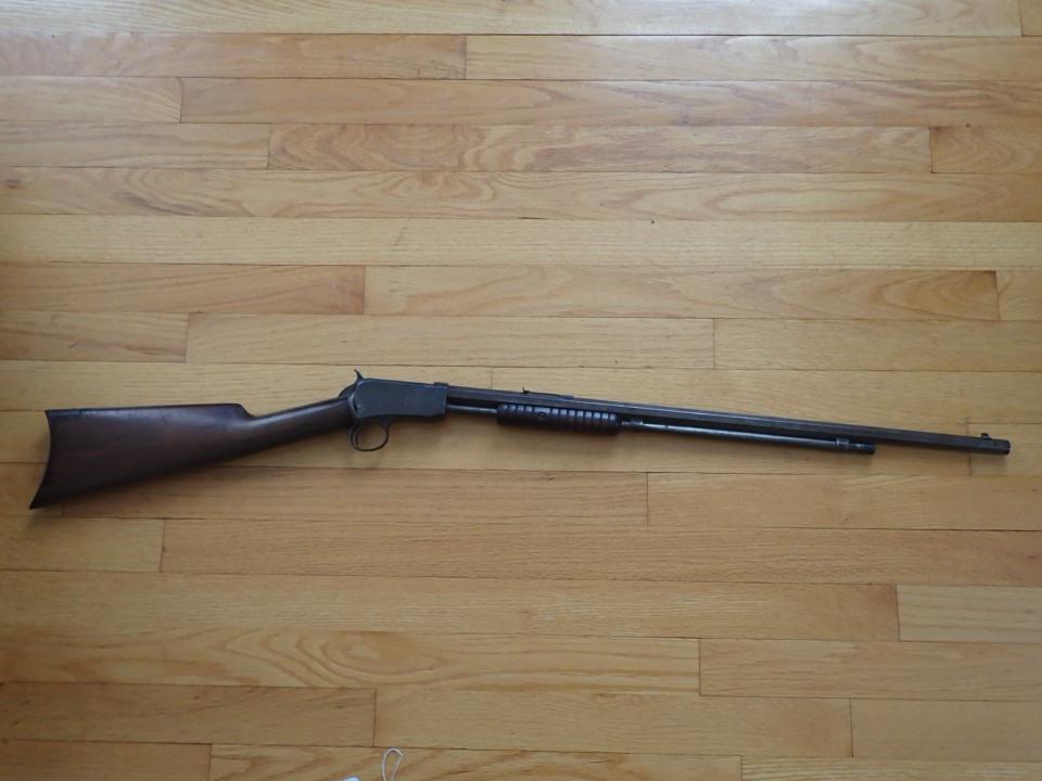 Winchester 22 Caliber Pump Rifle with Hexagonal Barrel: Serial No. by Trigger 401457. Serial No. near Barrel 406152. Also marked 22 Short. Overall Length 40". Barrel 23 1/2". Has wear and minor pitting in spots.