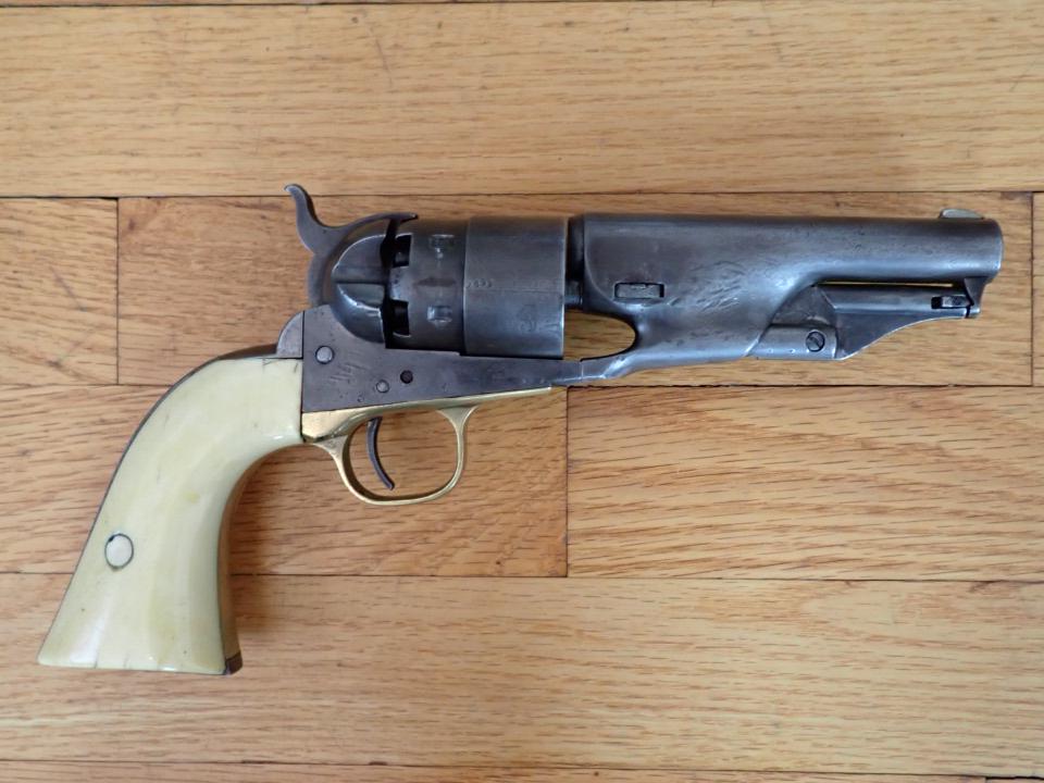 Colt 44 Short Barrel Revolver. Bone Handle. Serial No. 156697: Matching Serial Numbers. Has some pitting and bone handle has some cracking.