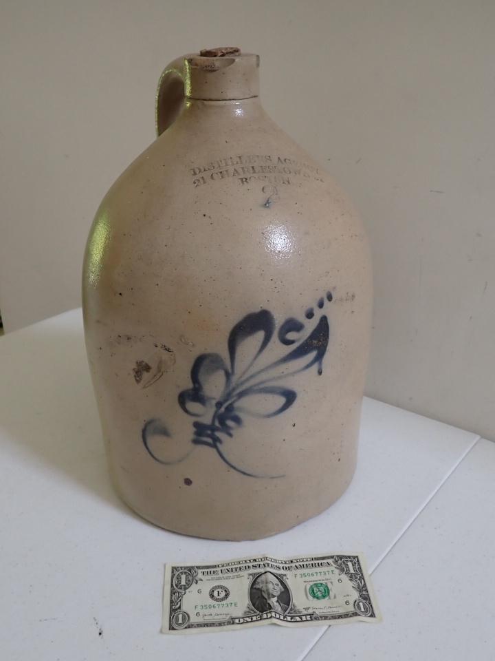 2 Gallon Distillers Agency Boston Stoneware Jug.: Cobalt Floral Design. 21 Charlton Street Boston. Has dent. 14 1/2" high.