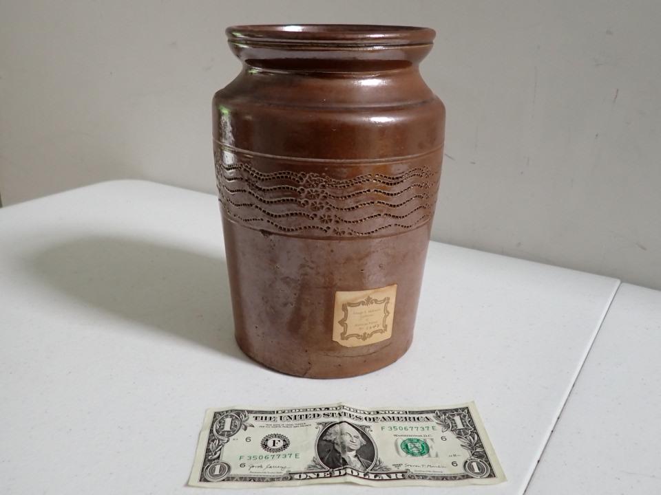 Redware Small Crock - George S. McKearin Collection: American Pottery Label. McKearin Published Books on Early glass and collected glass and pottery. Crack appears to have been made during firing. Incised Design around edge. 8 1/2" tall by 5" diameter.