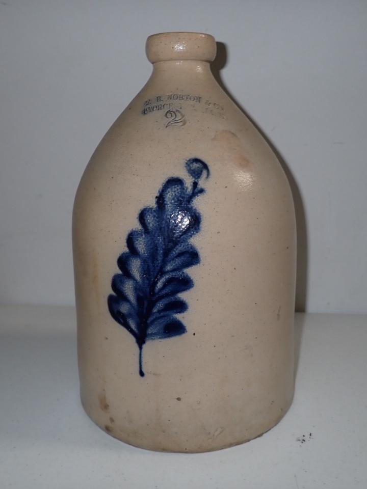 F. B. Norton & Co. Worcester, Mass 2 Gallon Stoneware Jug: Blue Cobalt Design. Bottom Repair. Chip around rim. 14"