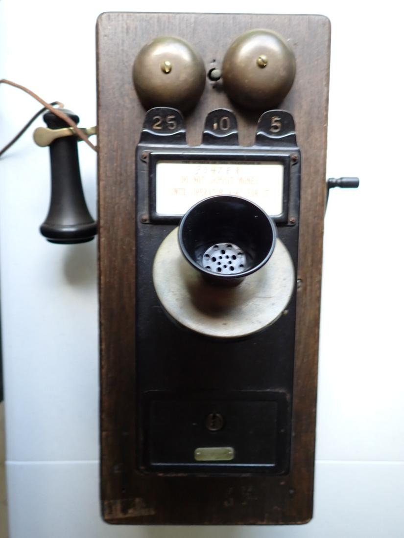 Oak Wall Pay Telephone Coin Box by Gray Telephone 1911: Patented May 23, 1911. Inside of Phone Marked Western Electric. Has key to Open. Wood has a little wear. Receiver hook is loose. Some tape. 20 1/2" x 9". Base 13" from back of phone to top of mouthpie