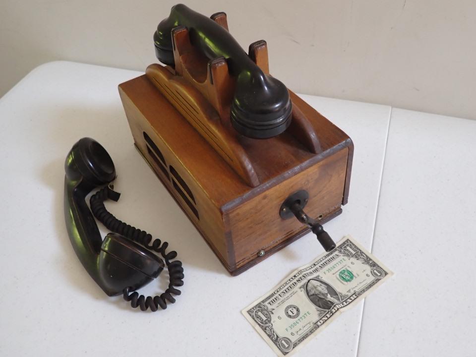 Oak Telephone Box with 2 Handsets. Not attached.: Turning the crank makes it ring. Bottom screwed on. Has speaker grill on the side.