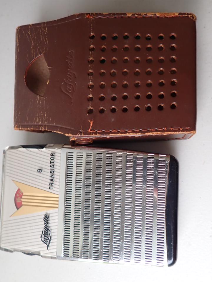 Lafayette Model FS 91 9 Transistor. Japan Radio: Untested. Has chrome case covering speaker & modern design dial. Has folding easel back stand. Some marks near earphone. Case Wear. Overall Good Condition.