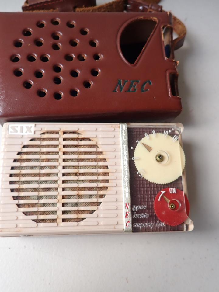 NEC Model NT-61. Six Transistor Japanese Radio: Untested. Made by Nippon Electric Co. Ltd. Overall good condition. Has a little wear where indented to open back cover.