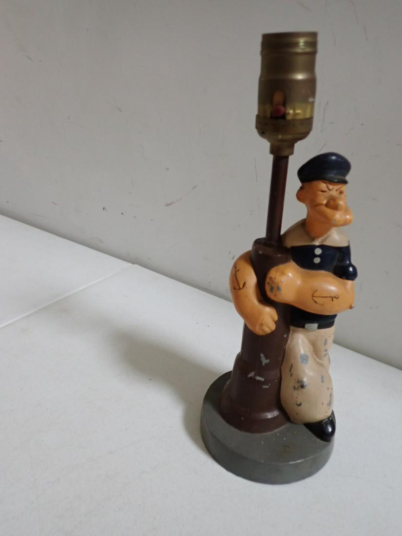 Vintage Popeye Cold Painted Cast Metal Lamp: Popeye Holding onto Light Post. Copyright 1935. King Features 11 1/2". Needs cord. Has some wear.