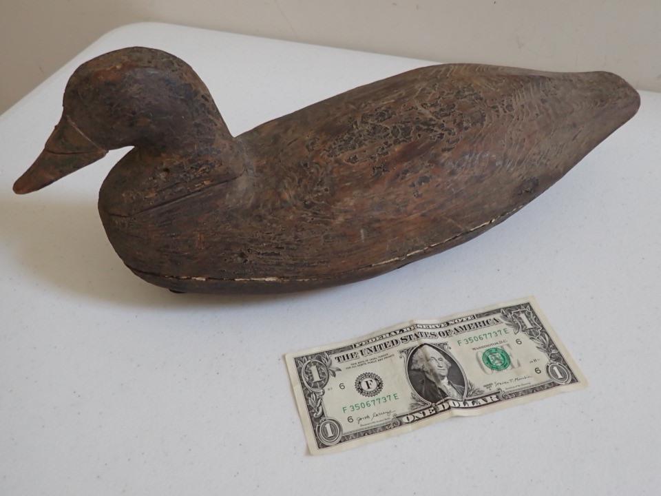 Vintage Wooden Duck Decoy. Retains some black paint.: Has white wear seam on boy connects. 13 1/2".
