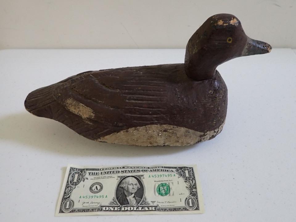 Vintage Wooden Duck Decoy. Brown and White: With Carved Feathers. Black Beak. Painted Eyes. 12 1/2". A little wear.