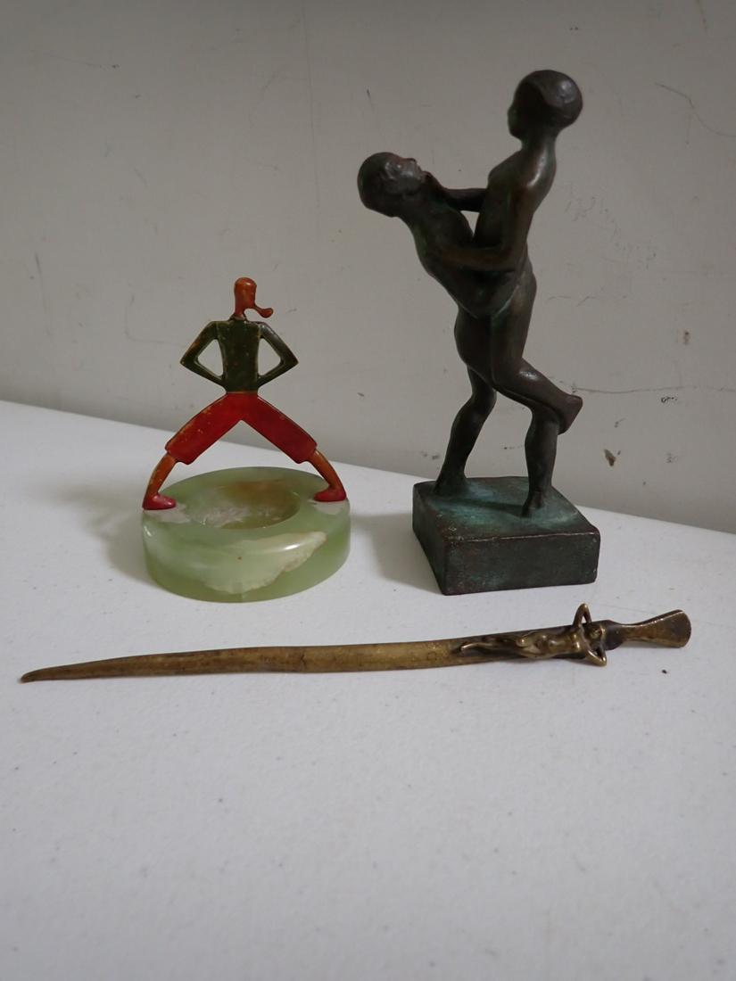 Bronze Nudes, Deco Paper Clip Holder and Letter Openers: Bronze Colored Nudes - Marked A.V. Hjelmquist 5 3/4", Alabaster Paper Clip Holder with Deco Figure of Man with Pipe 3 1/2" - Alabaster has some splitting - Brass Letter Opener with Reclining Nude 7 1/