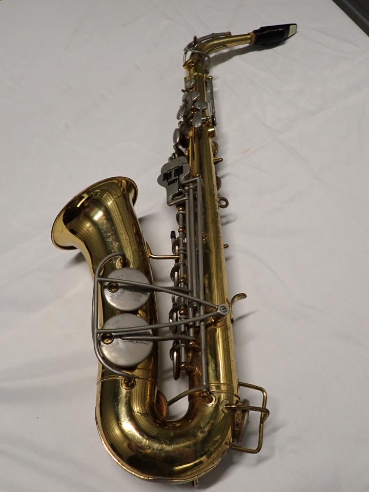 Brass Bundy Selmer Saxophone Mother of Pearl keys: Has some denting