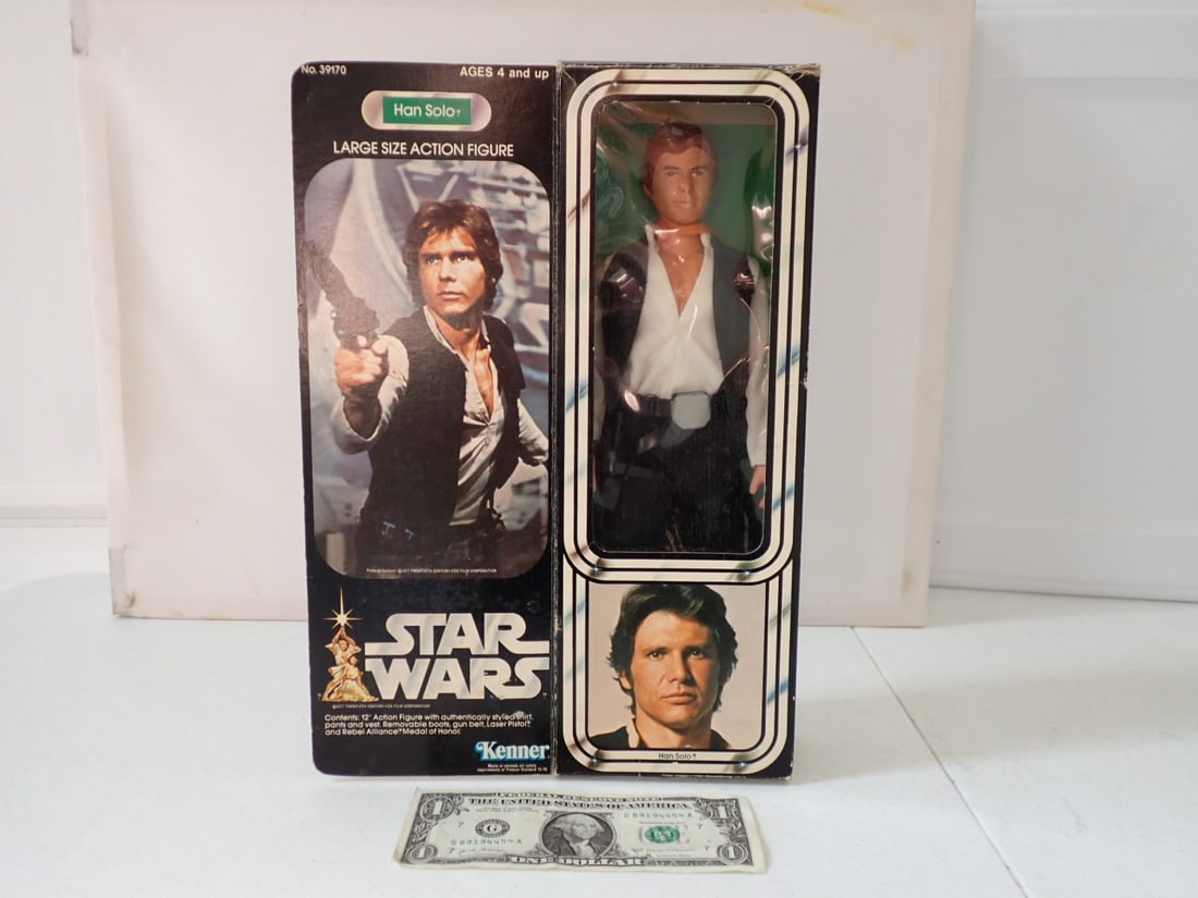 1977 (1978?) Star Wars Han Solo Action Figure in Box: Large Sized Action Figure in Box. No. 39170. Contents: 12" Action Figure with Authentically Styled Shirt, Pants and Vest. Removable Boots, Gun Belt, Laser Pistol and Rebel Alliance Medal of Honor. Box