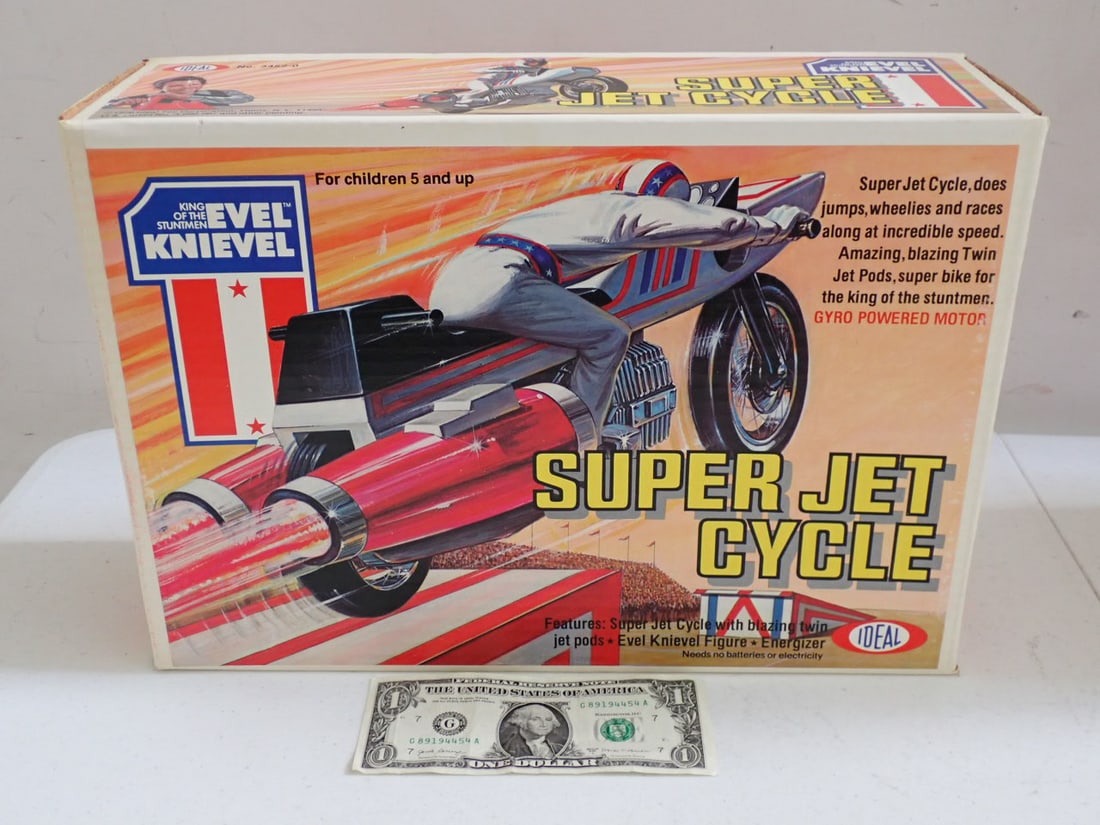 1976 Ideal Toy Co. Evel Knievel Super Jet Cycle in Sealed Box: One corner has minor denting. Otherwise, overall good condition.