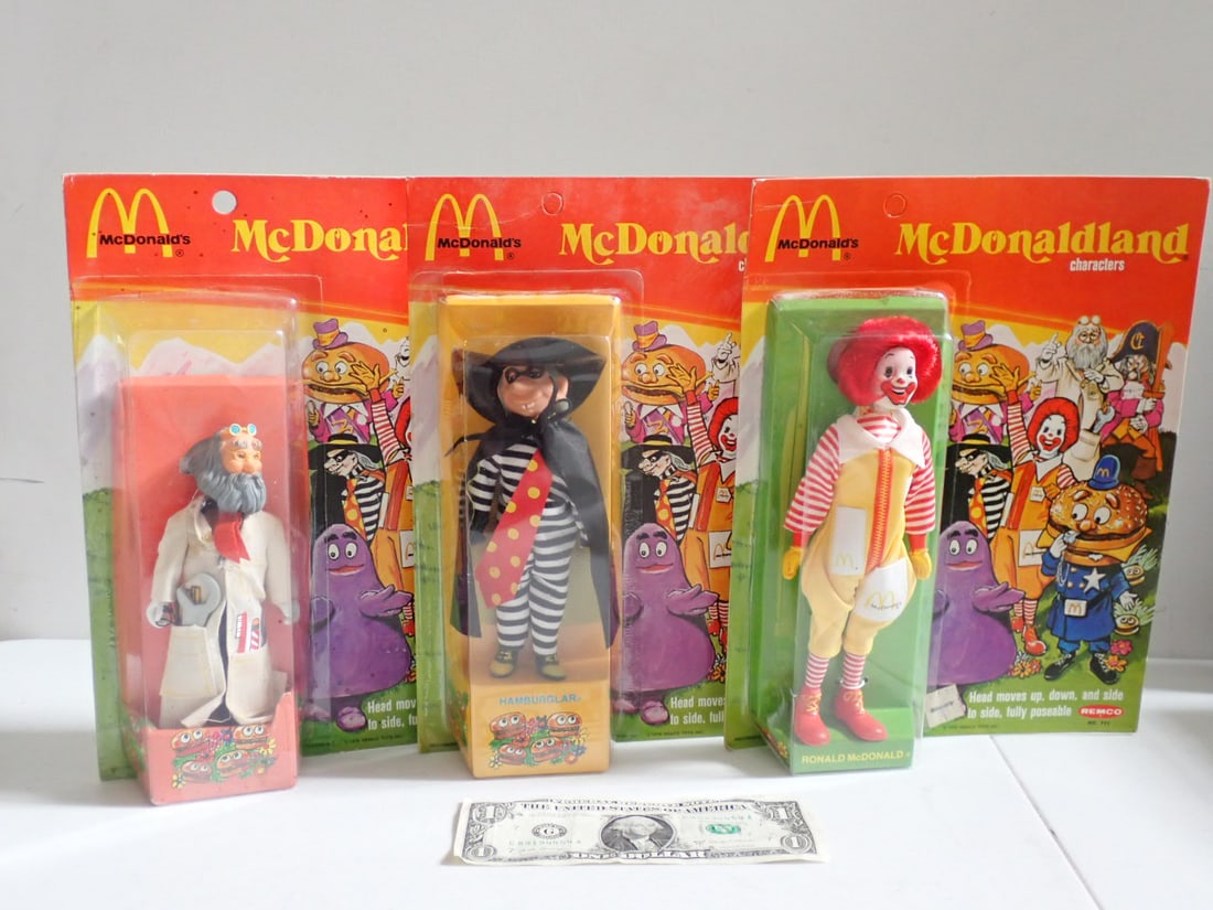 (3) 1976 Remco McDonaldland Characters sealed on cards: Ronald McDonald Unpunched on card, Hamburglar Unpunched & Professor on Card. Some discoloration of cards and edge wear.