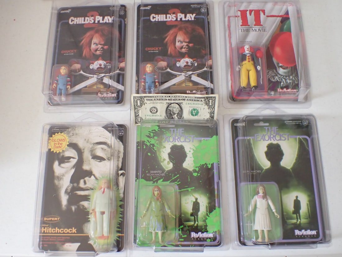 Horror Movie and Alfred Hitchcock Super7 ReAction Figures: 2 Exorcist, 2 Child's Play, "It" The Movie and Glow in the Dark Hitchcock. The Exorcist have only minor wear, Child's Play have some wear on front and edges, "It" has creasing on reverse, Alfred Hitch