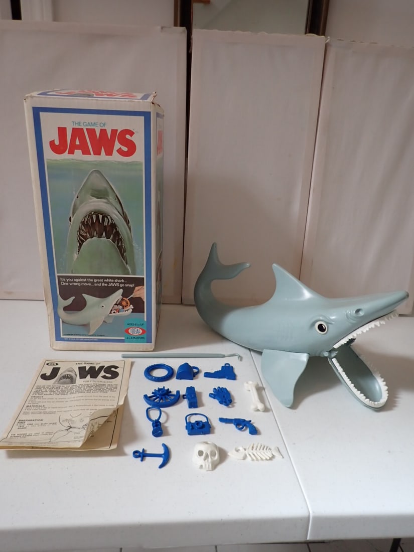1975 Ideal The Game of Jaws with Box.: Has parts and instructions. Please see photos for details of parts. Box shows some wear with some creasing and denting.