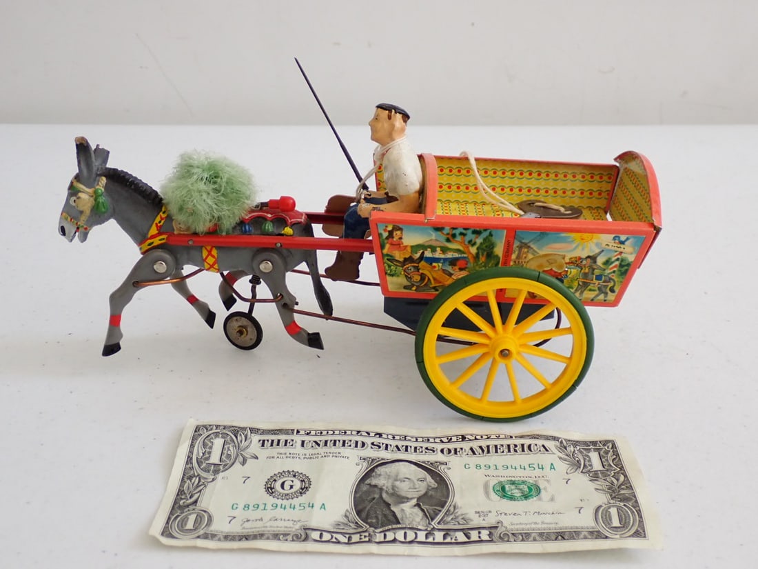 Tin Litho Mechanical Mule Cart and Driver Made in Germany: Has DE Loetz Price Tag - Good condition with light wear. Wheels look to be replaced with larger ones as the key won't go past the wheel to wind it. 8 1/2".