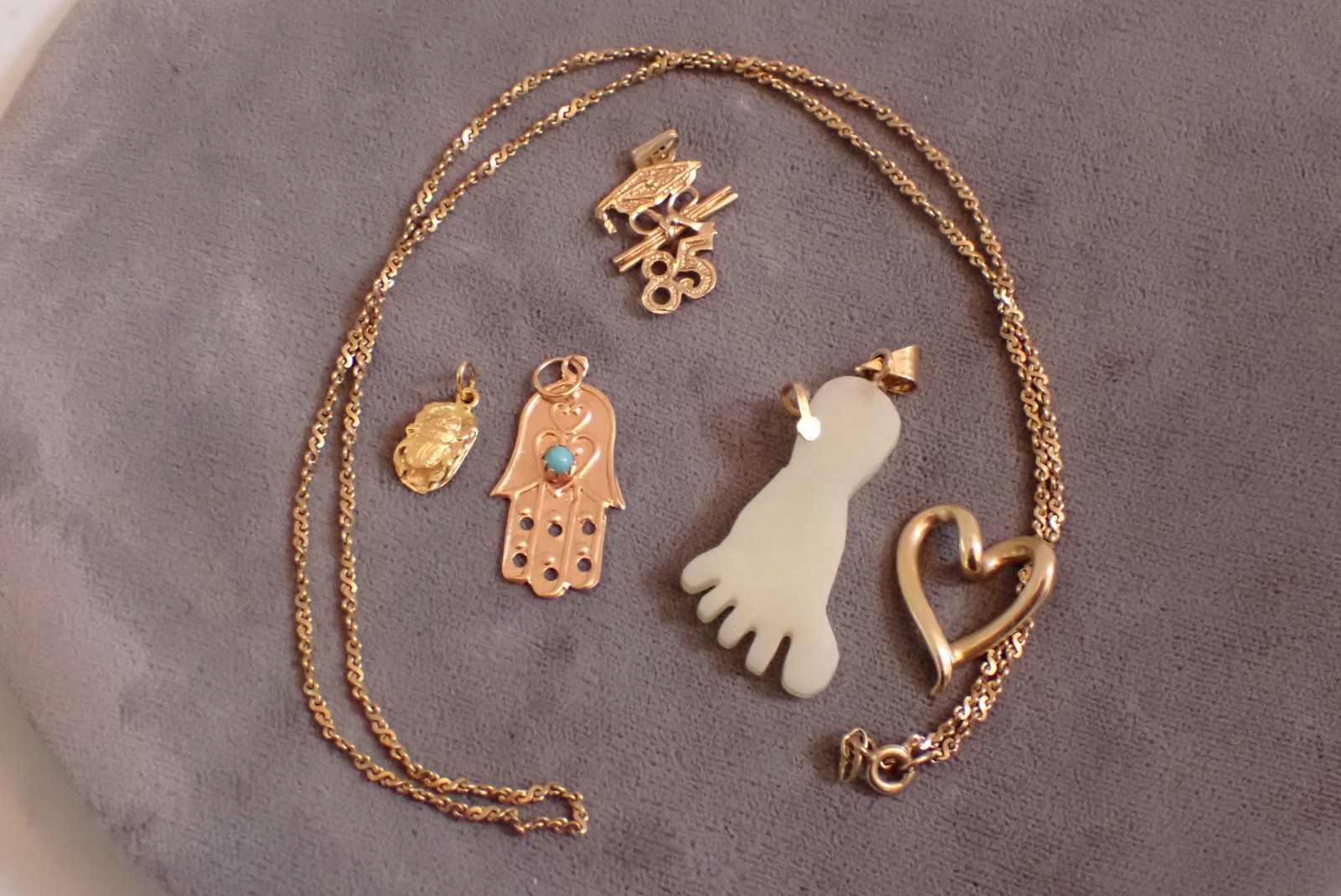 14K 19" Chain, Heart, 85 Grad Charm, Hand and Other Charm: Total Weight - Grams - 9.3 Grams - Foot not weighed