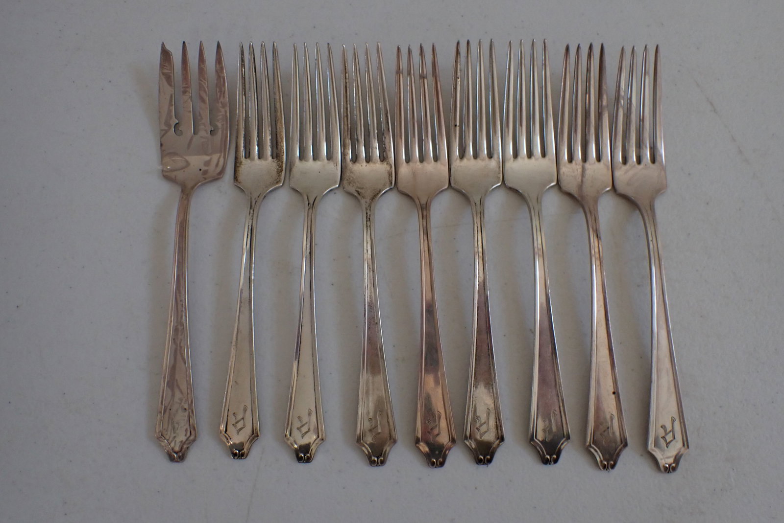 Minnet International Sterling Silver Forks: 8 Dinner Forks, 1 Serving Fork. Monogrammed. 14.7 Troy Ounces.