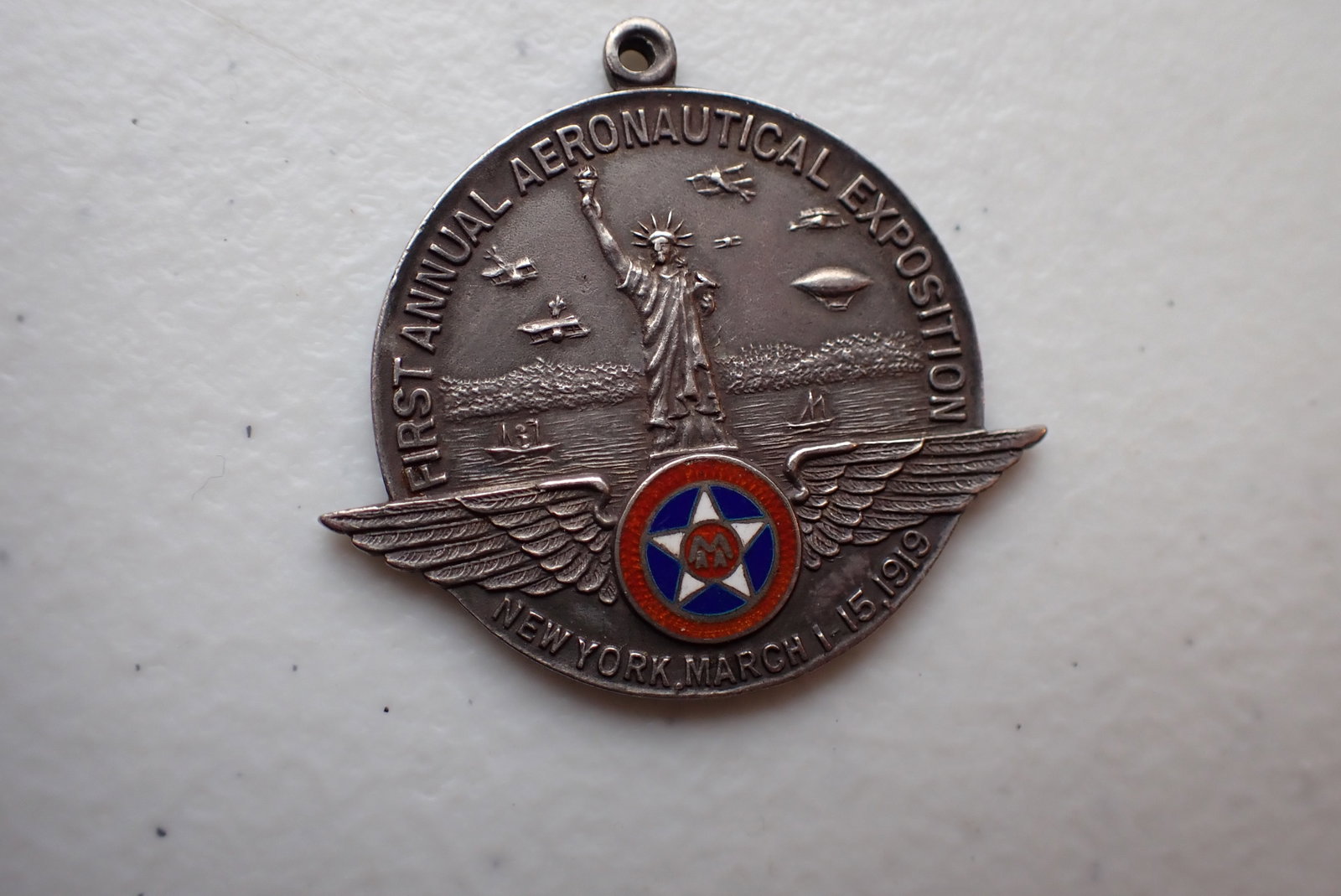 1919 Sterling New York Aeronautical Expedition Medal: Medal Marked "First National Aeronautical Exposition New York March 15, 1919. Has Wings and Enamel Star, Airplane, Dirigibles and the Statue of Liberty. Marked "Sterling" and Johnson Mfg. Co. N.Y. 1 1