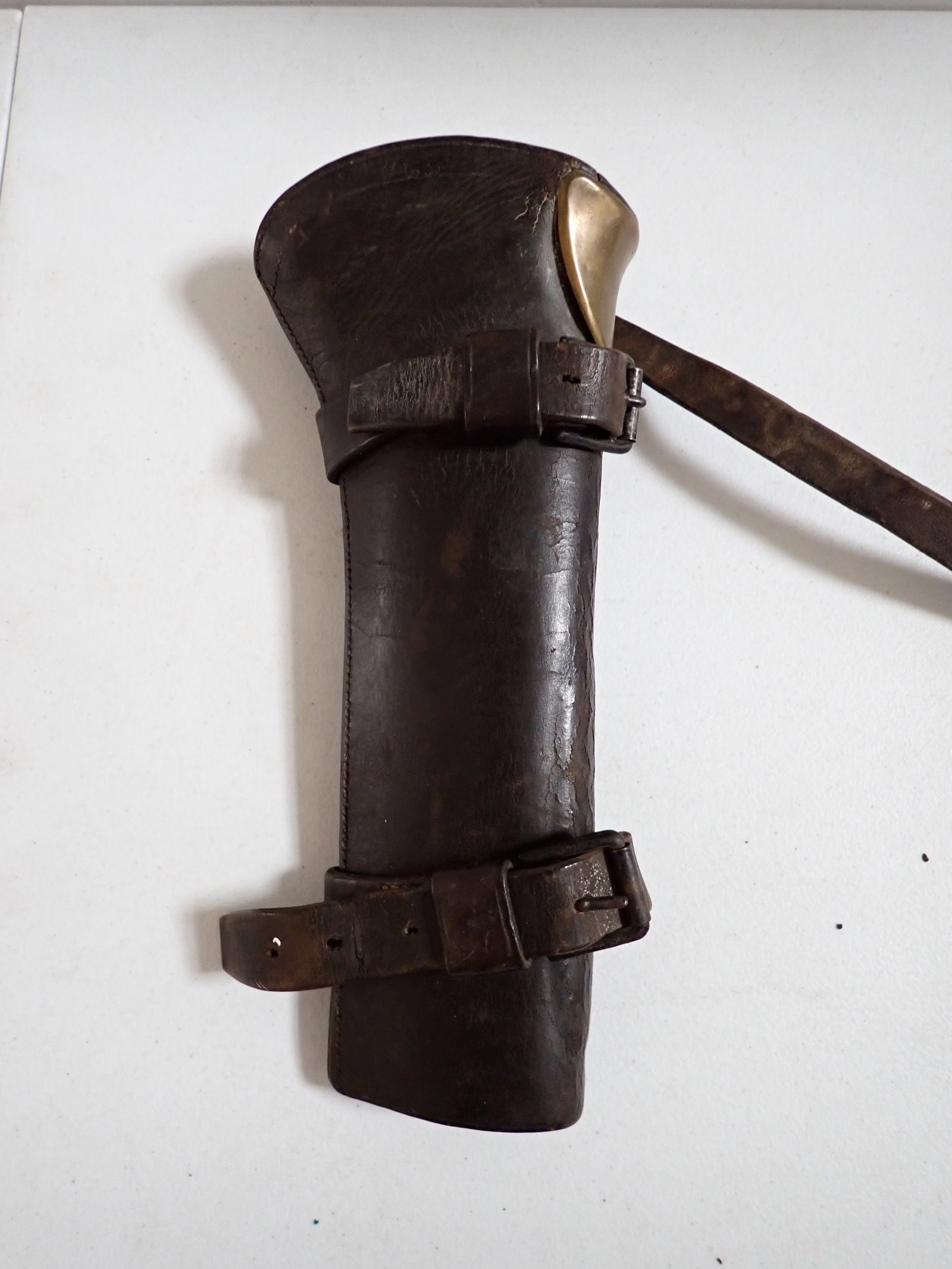 U.S. Leader Cavalry Rifle Holster.: Leather with Brass Holster. Numbers marked at top looks to be 100 with large 55 overstruck on it. Has some leather crackling and wear.