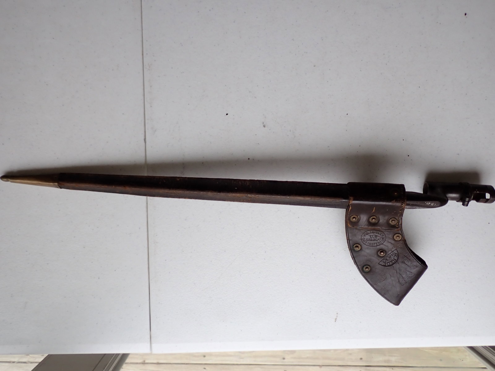 Civil War Era Bayonet and Scabbard: Bayonet marked U.S. Ord. Sub-Inspector Nece Philar 23" length with scabbard. Bayonet 21". Stiching on leather is loose.
