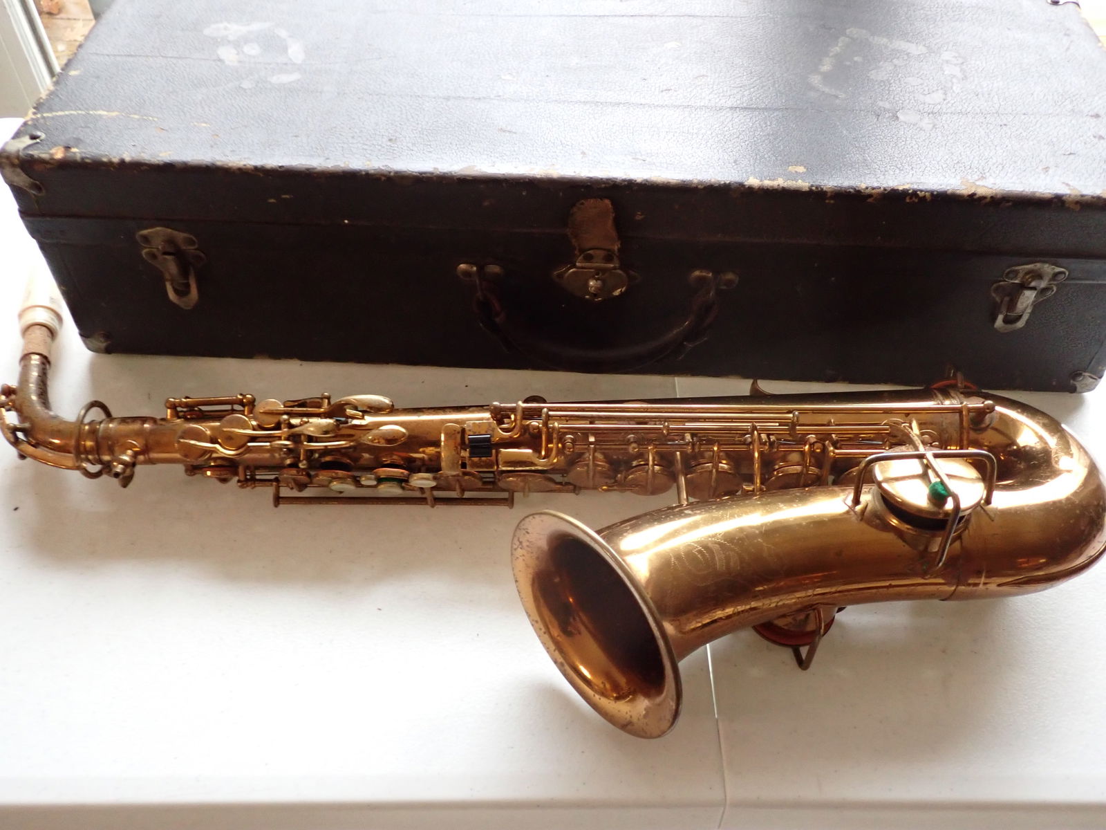 Wurlitzer American Saxophone with Case: In original case. Has some pitting.